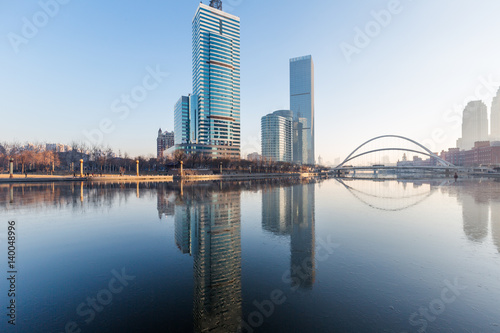 River And Modern Buildings Against Sky in Tianjin,China.