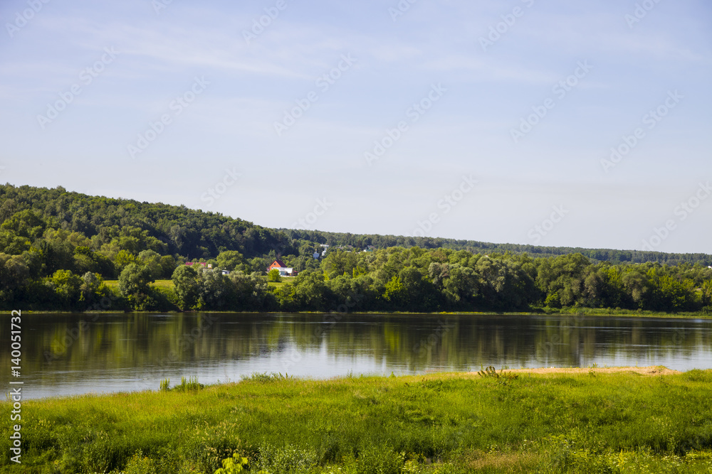 beautiful landscape with a river and a sandy beach on a summer day. beautiful landscape with a river and a sandy beach on a summer day.