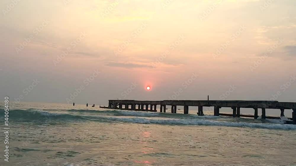 Old bridge pier against beautiful sunset sky use for natural background and seascape Old bridge pier against beautiful sunset sky use for natural background and seascape