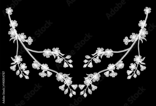 Embroidery blossoming cherry branches on a black background. white petals fall off. fashion clothing decoration. traditional pattern.