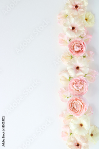 Beautiful pink and white ranunculus flowers, sweetpea flowers on white background,top view 
