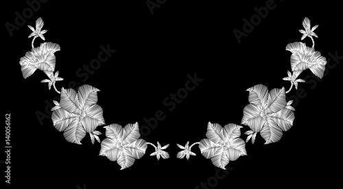Embroidery white wild flowers on a black background. imitation lace. fashionable clothing decoration. traditional pattern.
