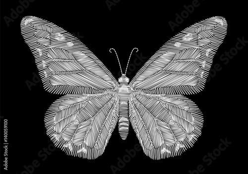 White butterfly embroidery on black background. ethnic neck line design graphics fashion wearing