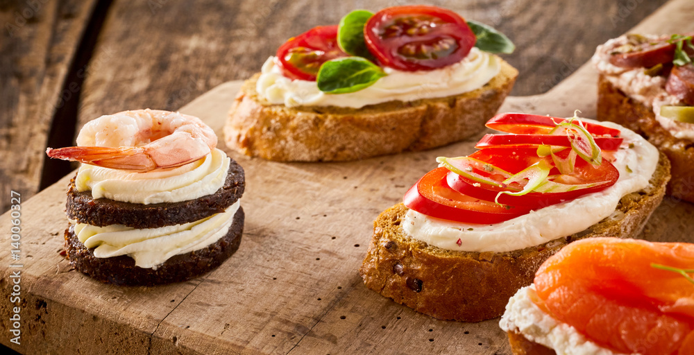 Assorted canapes on bread and blinis Assorted canapes on bread and blinis