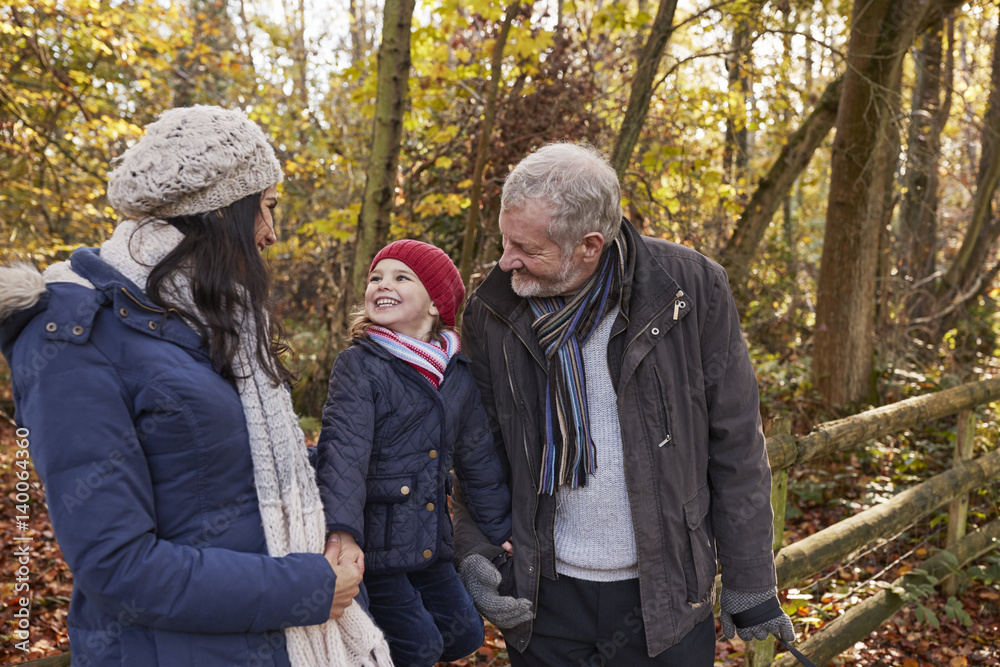 Multi Generation Family Enjoying Walk In Fall Landscape Multi Generation Family Enjoying Walk In Fall Landscape