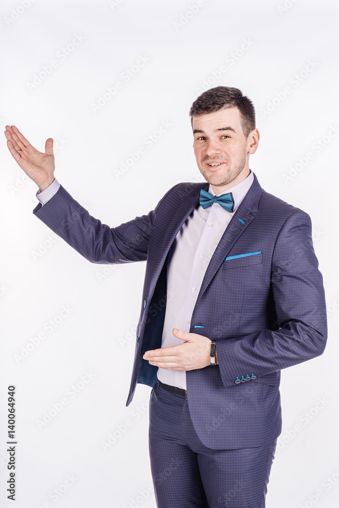man presenting or showing something your text or product. human emotion expression and lifestyle concept. image on a white studio background.