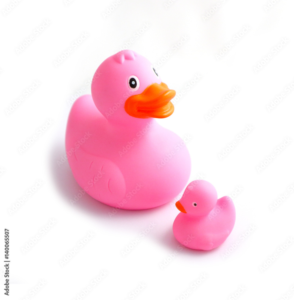 Big blue rubber duck and small duckling, isolated on a white background. Children bath toys. Close up. Big blue rubber duck and small duckling, isolated on a white background. Children bath toys. Close up.