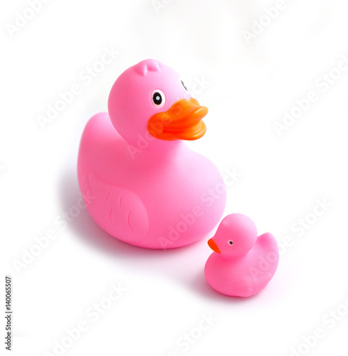 Big blue rubber duck and small duckling, isolated on a white background. Children bath toys. Close up.  