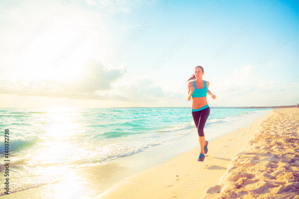 Young Woman Jogging On The Beach
