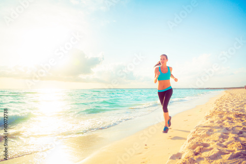 Young Woman Jogging On The Beach © nullplus