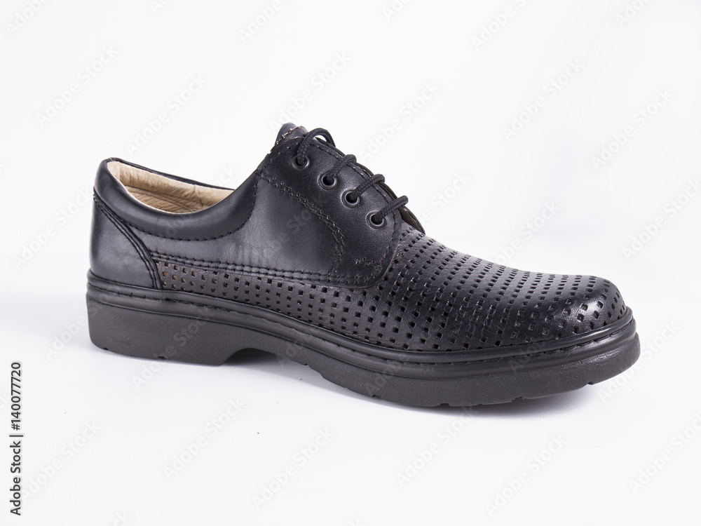 Black leather boot on white background, isolated product. Black leather boot on white background, isolated product.