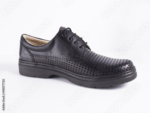 Black leather boot on white background, isolated product.