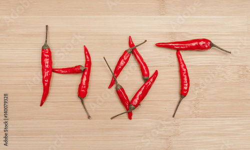 Hot Text Made Of Red Chili Peppers On Table