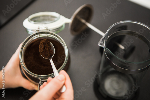 Woman making coffee