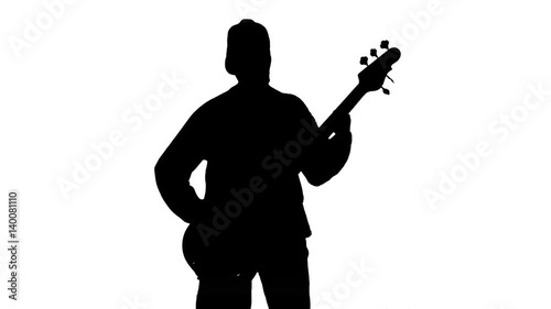 Silhouette of musician with bass guitar