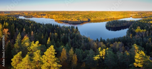 Peaceful panorama lake view with fall colors at Aulanko nature park in Finland