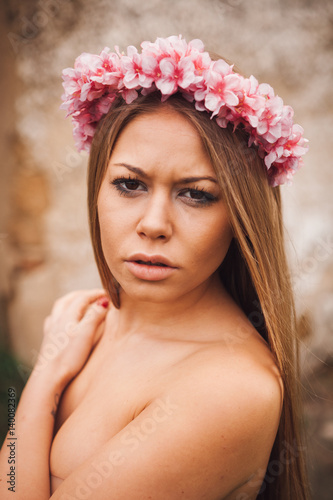 Beauty portrait of attractive blond girl with a beautiful headband
