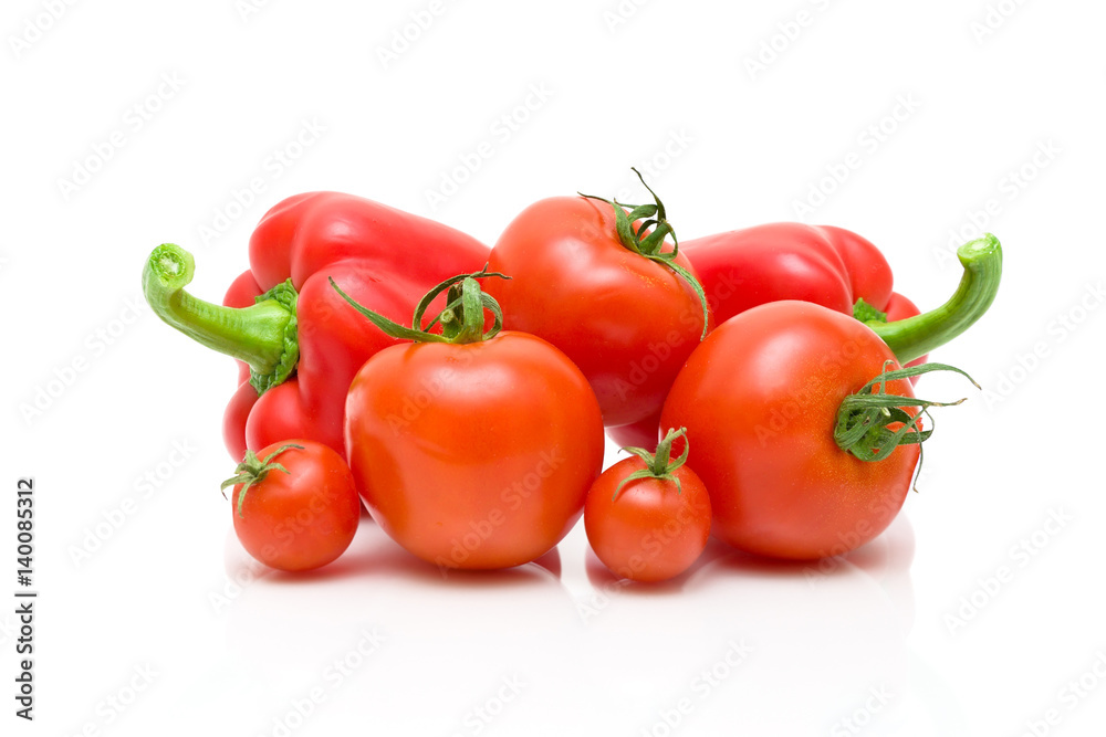 Sweet peppers and tomatoes on a white background Sweet peppers and tomatoes on a white background