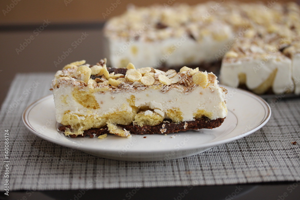 A piece of cake on the plate. Homemade rustic tart with muesli.

