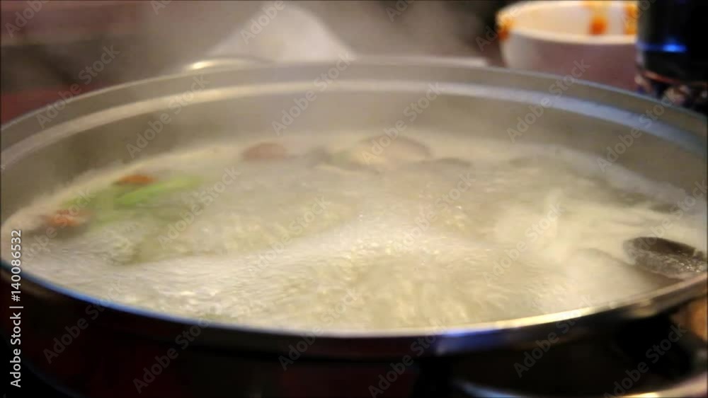 Sukiyaki or Shabu shabu or Hot pot, Sliced pork with vegetable in Boiling soup. Ready to eat Sukiyaki or Shabu shabu or Hot pot, Sliced pork with vegetable in Boiling soup. Ready to eat