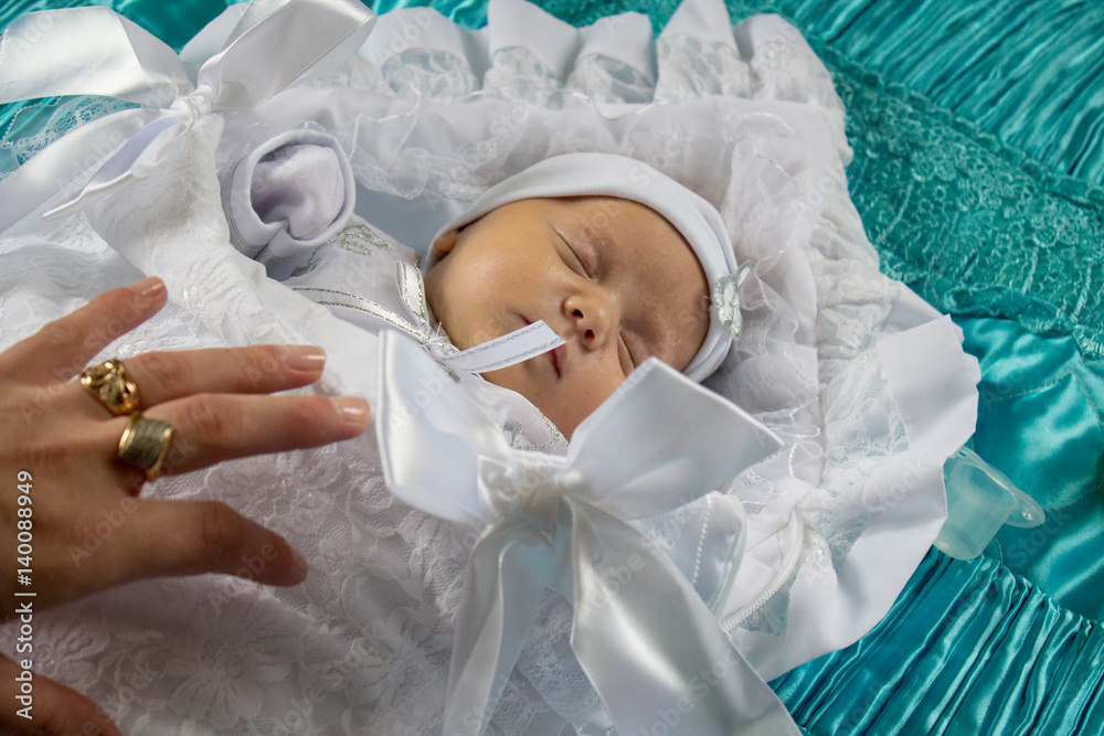Fototapeta premium baby wrapped in a white sheet