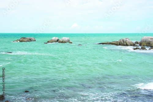 Natural small granite rock formation at sea in the afternoon, Belitung Island Indonesia.