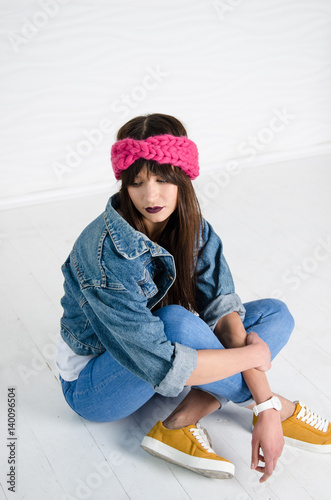 young woman in fashionable pink merino wool headband