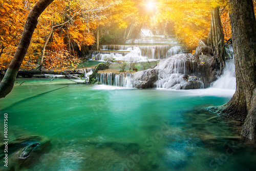 Beautiful waterfall in autumn forest 
