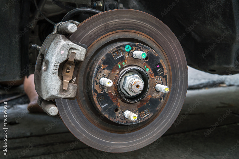 Closeup disc brake of the vehicle for repair.