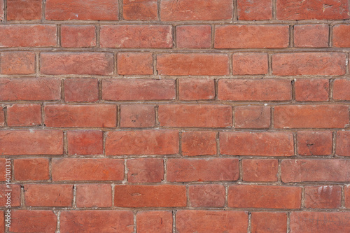Texture of old brickwork with spots and chips on bricks.