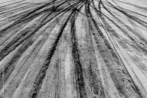 Abstract texture and background car drift skid mark on asphalt street road, Automobile and automotive concept and background. photo