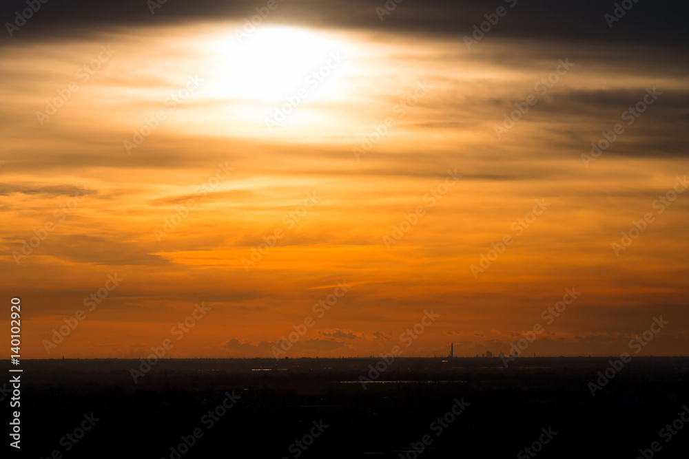 Po Valley with skyline of Milan at sunset