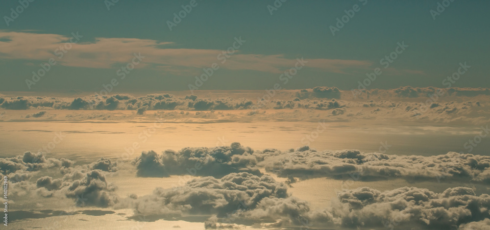 Fluffy white clouds on blue sky over idyllic sea
