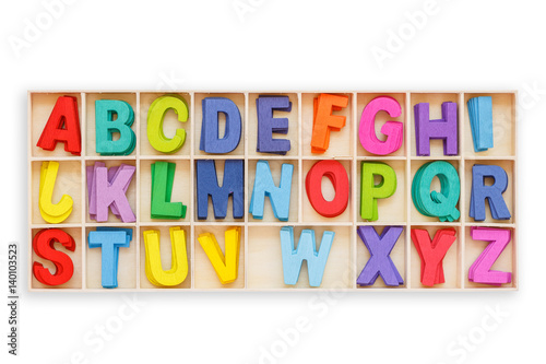 Colorful wooden alphabet in square box. Top view. Isolated on white. Saved with clipping path