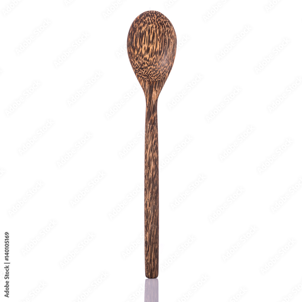 Brown spoon made from palm wood. Studio shot isolated on white Brown spoon made from palm wood. Studio shot isolated on white