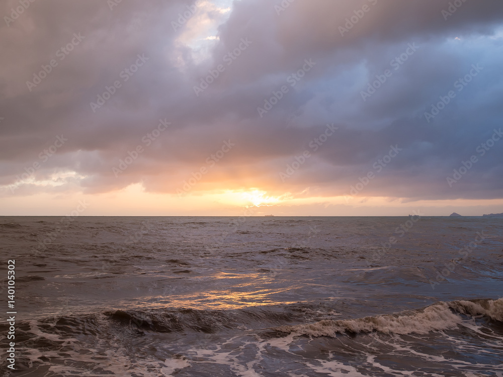 Storm sea and cloudy sky