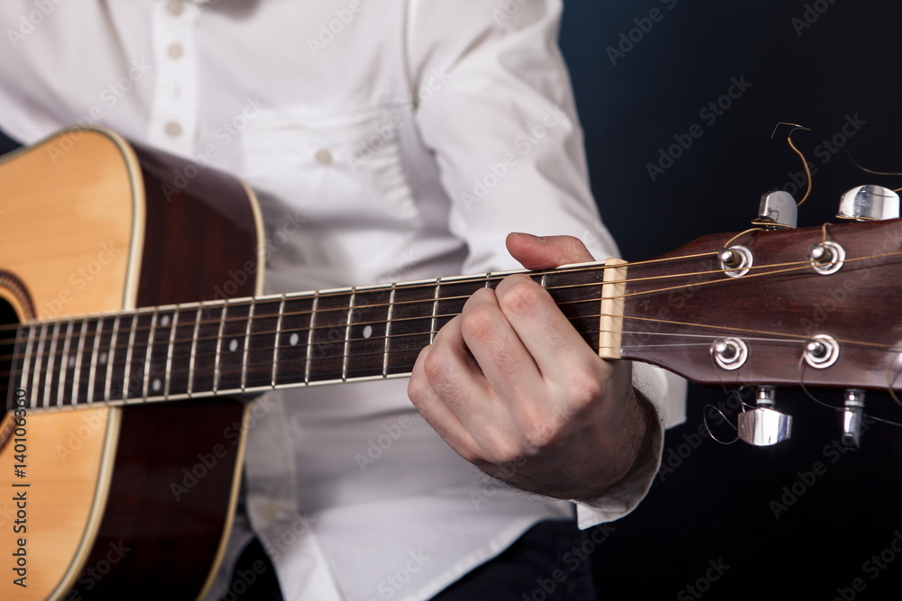 Fototapeta premium man playing classical guitar close up isolated