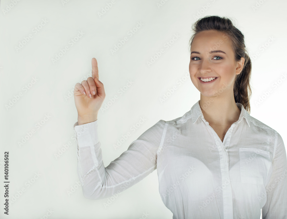 Young business woman holds hand palm up and smile. White background Young business woman holds hand palm up and smile. White background