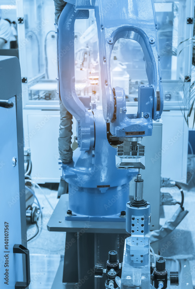 Automatic robot in assembly line working in factory. Smart factory industry 4.0 concept. Automatic robot in assembly line working in factory. Smart factory industry 4.0 concept.
