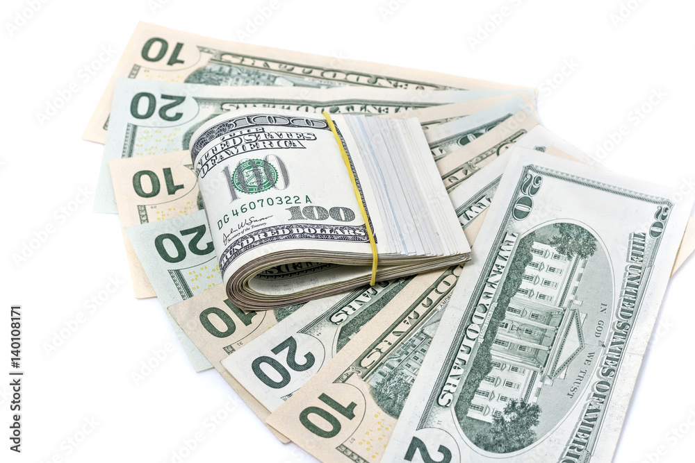 A pack of dollars on a background of dollars isolated A pack of dollars on a background of dollars isolated
