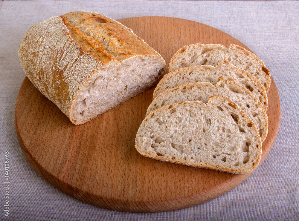 Fresh slice of white bread on a cutting board
