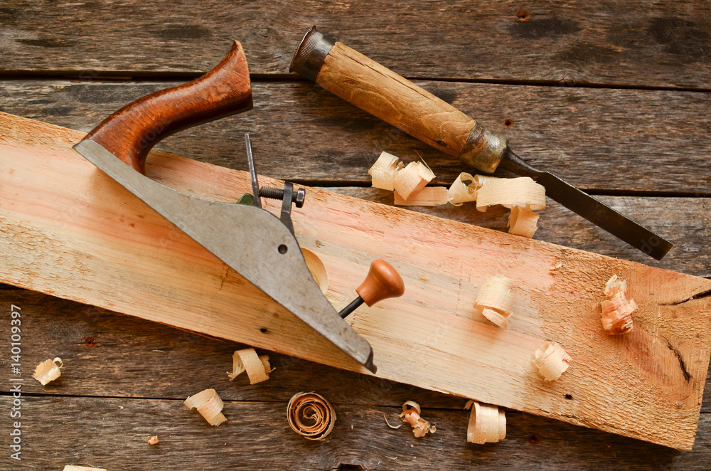 Carpenter's tool chisel, plane, on an old bench Carpenter's tool chisel, plane, on an old bench