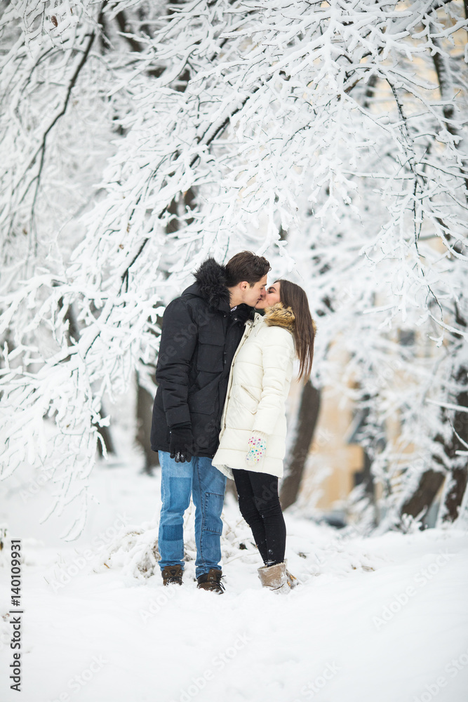 couple lovers kiss winter street forest. Couple love