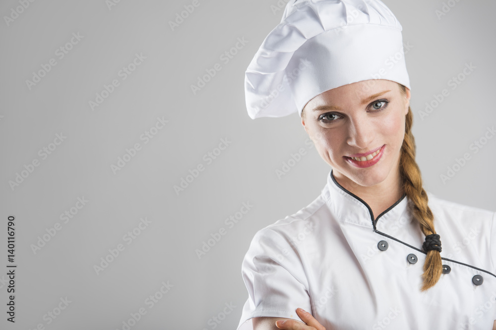 woman chef close up portrait, smiling, isolated on grey background woman chef close up portrait, smiling, isolated on grey background