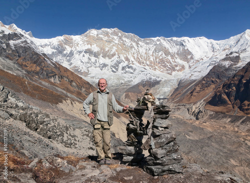 An experienced tracker about the ritual of the pyramid on the moraine of the circus Annapurna - Nepal Himalayas