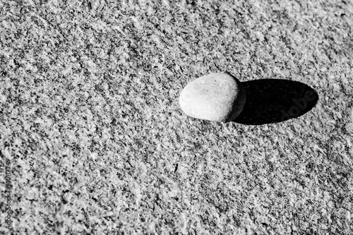 Pebble on a granite surface
