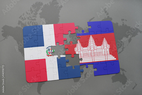 puzzle with the national flag of dominican republic and cambodia on a world map