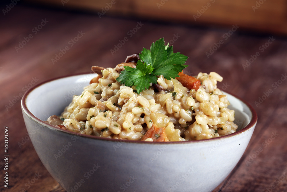 risotto with mushrooms, fresh herbs and parmesan cheese. risotto with mushrooms, fresh herbs and parmesan cheese.