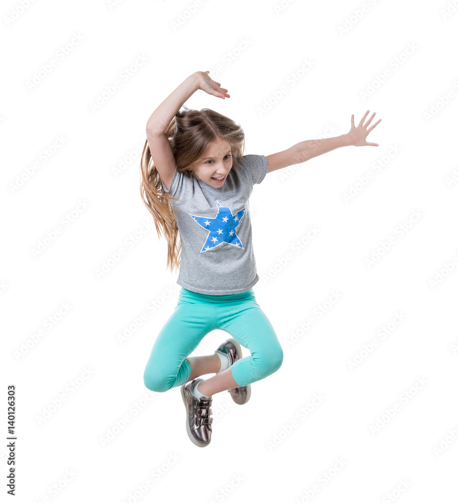 preteen jumping and enjoying her time, isolated Stock Photo | Adobe Stock