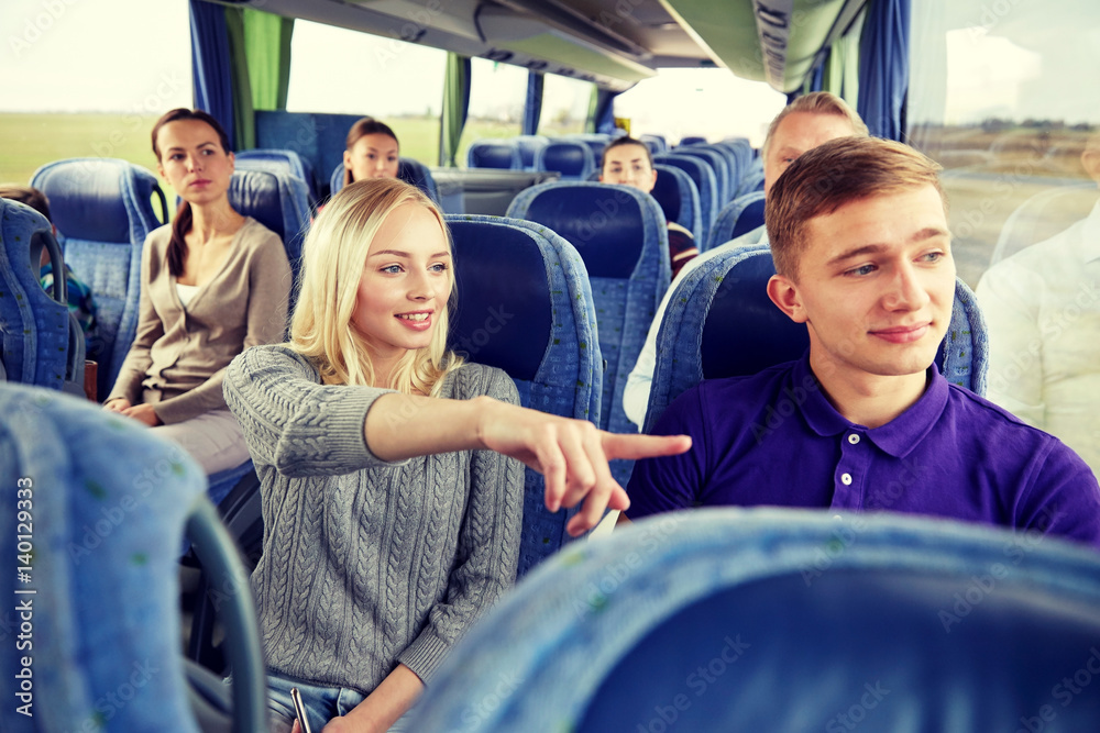 group of tourists in travel bus